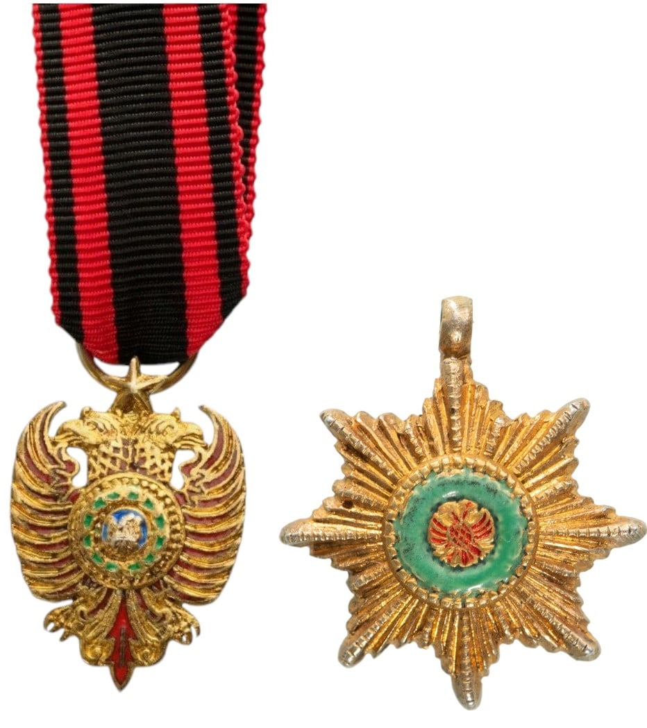 Order of Skanderberg: Grand Cross Set Miniature, instituted in 1925. Breast Badge, 22x15 mm., one side enameled, original suspension ring and ribbon. Breast Star, 12 mm., gilt Silver, center enameled, original suspension r