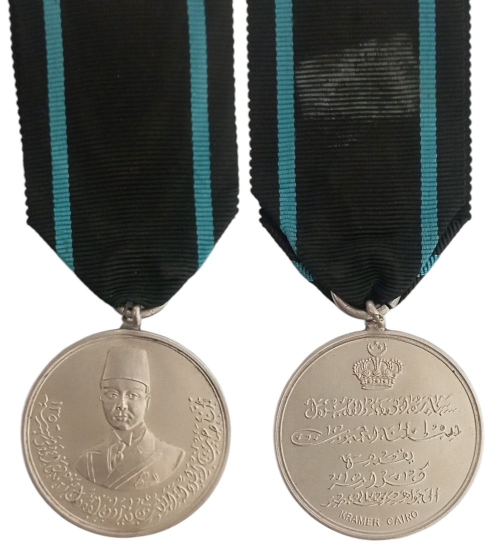 King Farouk Coronation Medal, 1937: Breast Badge, 35 mm, Silver, maker's mark “Kramer, Cairo”, original suspension ring and ribbon. Extremely fine! I