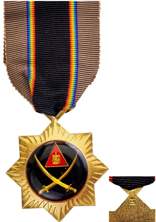 Bravery Medal (Nut al-Shujat), 1958: Breast Badge, 39 mm, gilt Bronze, one side enameled, original suspension ring and ribbon. Mint state! I
