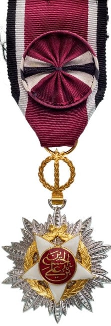 Order of Independence (Wisam Al Ordani Al Istiklal): Officer’s Cross, instituted in 1921. Breast Badge, 42x63 mm, Silver and gilt Silver, one side partially enameled, original suspension device, ribbon with rosette, with suspension bar and lapel hole