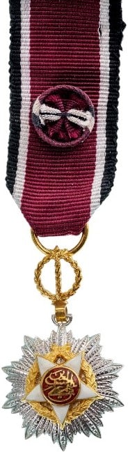 Order of Independence (Wisam Al Ordani Al Istiklal): Officer’s Cross Miniature, instituted in 1921. Breast Badge, 29x17 mm, Silver and gilt Silver, one side partially enameled, original suspension device, ribbon with rosette, with suspension bar.Rare 