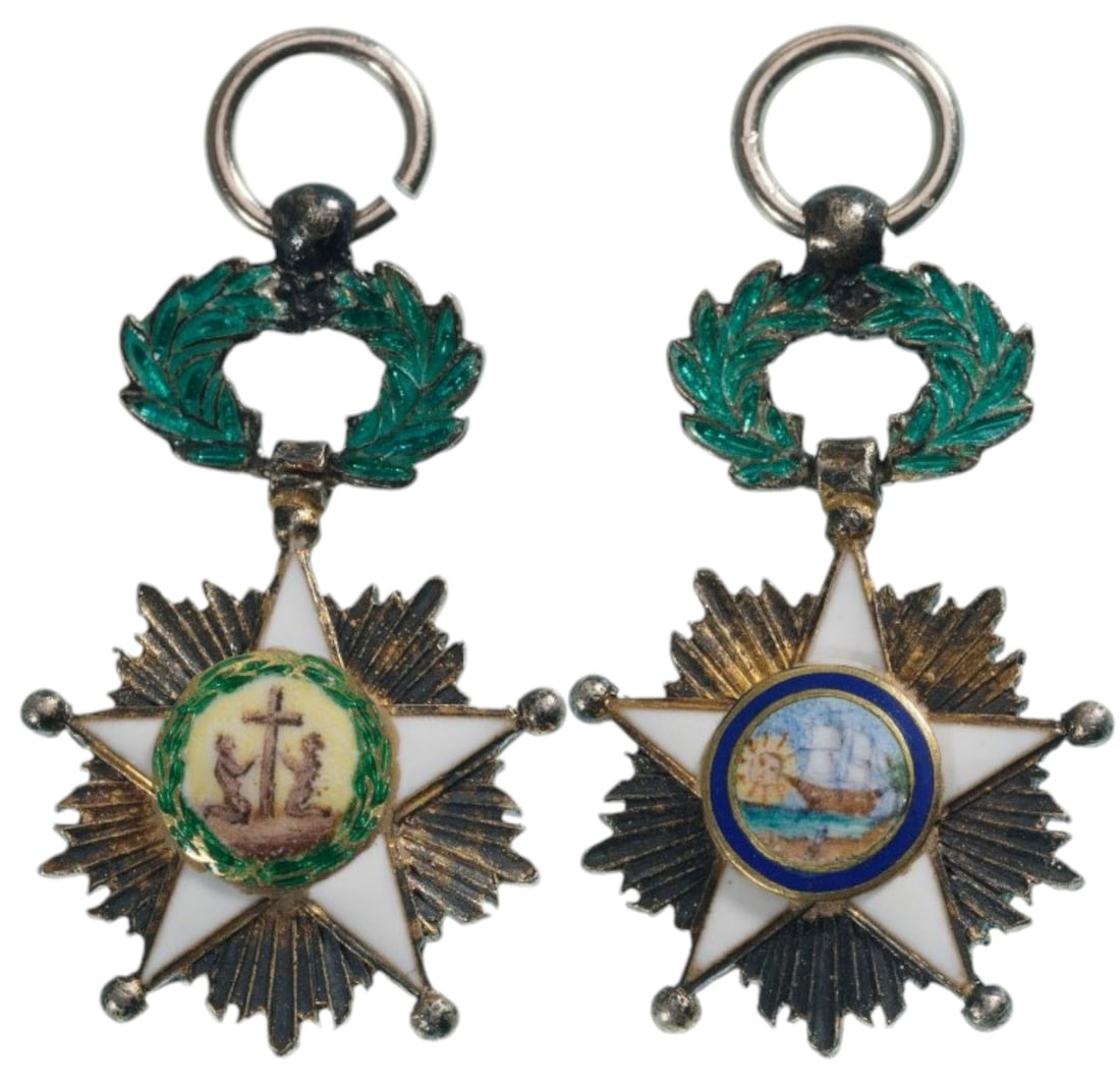 ORDER OF THE AFRICAN REDEMPTION: Knight's Cross Miniature, instituted in 1879. Breast Badge, 21x14 mm, Silver, both sides enameled, central medallions gilt, enameled, original suspension ring. Scarce and superb! I- R!