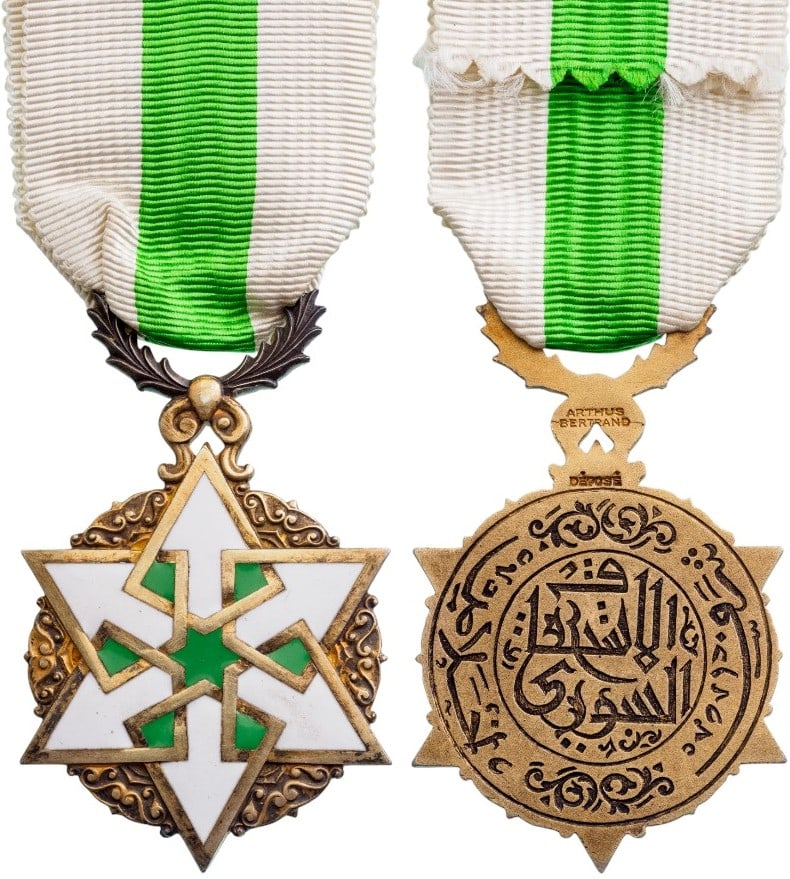 ORDER OF CIVIL MERIT: Knight's Cross, instituted in 1926. Breast Badge, 62x46 mm, gilt Silver, maker's mark "Arthus Bertrand - Paris", one-side enameled, five-pointed, white and green enameled star of elaborate geometric d