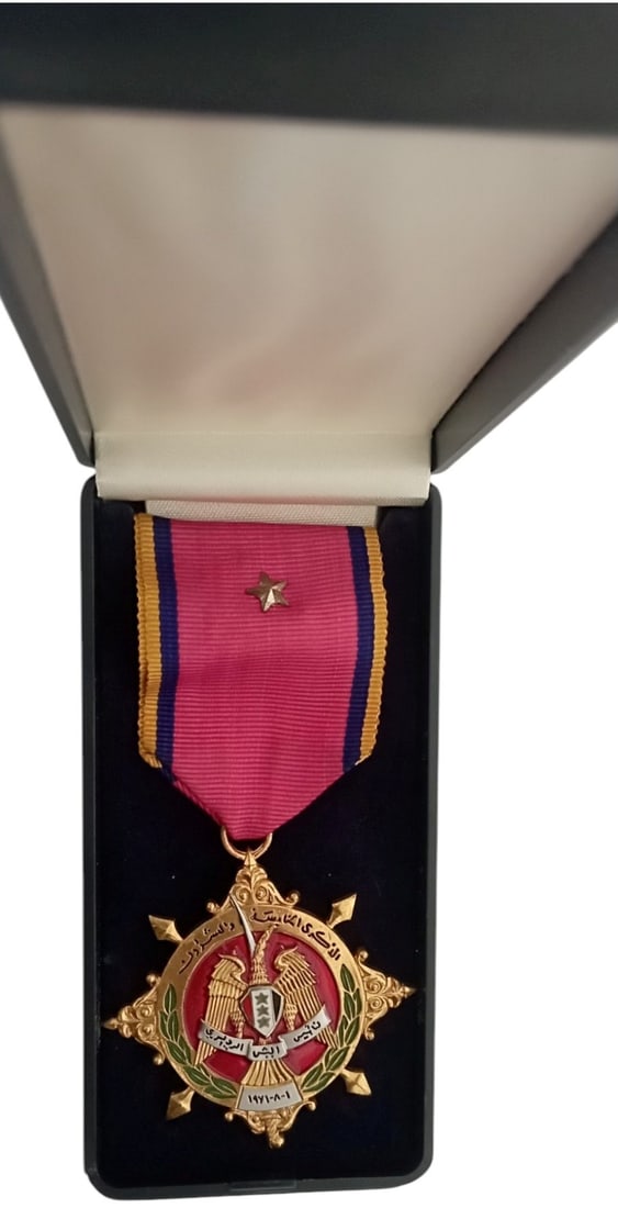 25th Anniversary of The Syrian Army Medal, 1971: Breast Badge, 48 mm, gilt Bronze, one side enameled, original suspension ring and ribbon, in case of issue. Mint stateI I