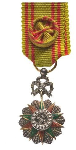 ORDER OF NICHAN IFTIKHAR: Country: TUNISIA Miniature Officer's Badge. Breast Badge silver partially gilt enameled central medallion silver enameled diamond cut rays suspension ring in gold French hallmark (eagle's head) origin