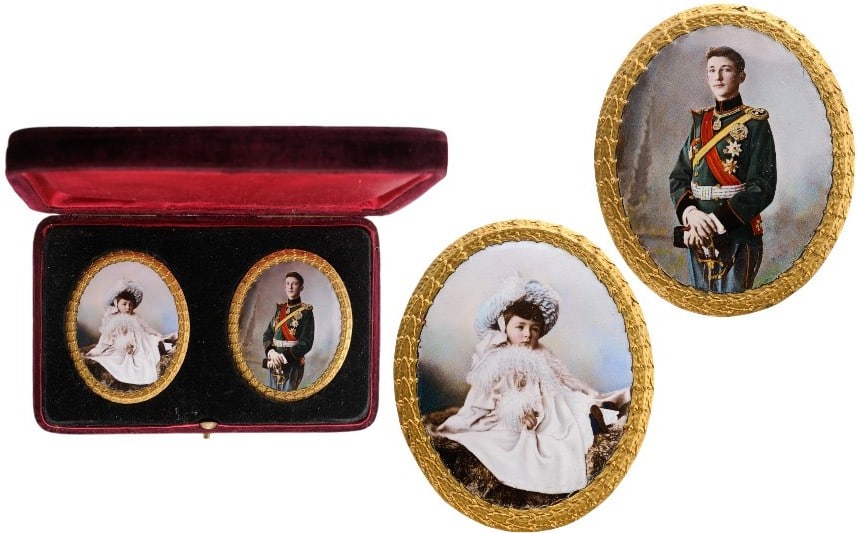 Two cased, miniature photo-portraits from Royal property: Oval, hand-painted photo-porcelains, 70 x 58 mm., the first portraying the young, Bulgarian Crown Prince Boris, about the age of 15, in dress uniform with orders, the second, an infant Princess, both 