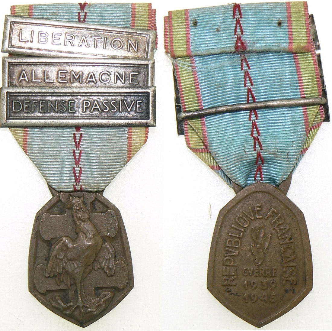 1939-45, War Commemorative Medal: Breast Badge, 40x28 mm, Bronze, ribbon bars "Liberation, Allemagne, Defense Passive" original suspension ring and ribbon. Rare! R! I