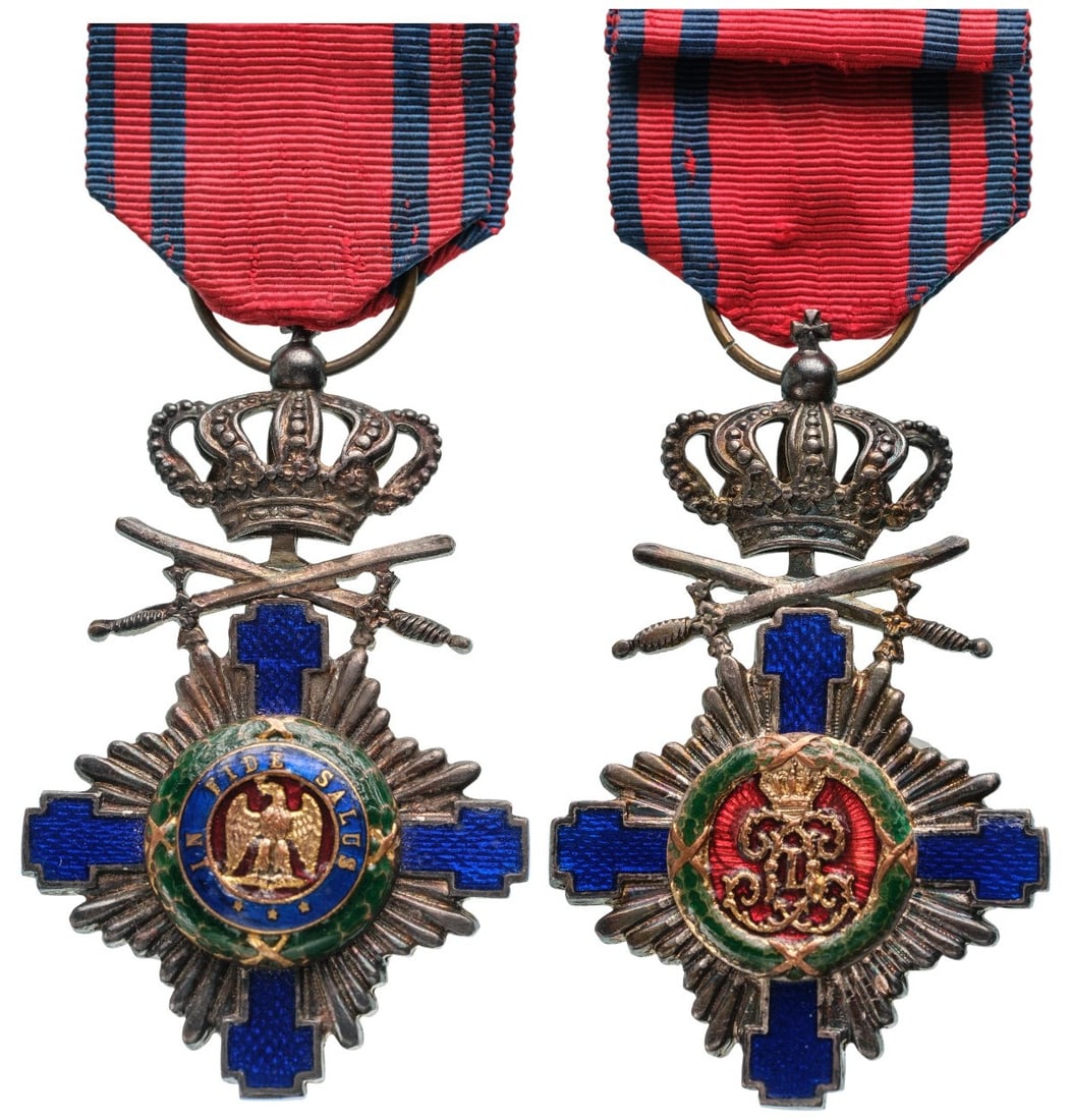 ORDER OF THE STAR OF ROMANIA, 1864: Knight's Cross, 1st Model (1877), for Military in Time of Peace. Breast Badge, 64x40 mm, Silver, superimposed part gilt and enameled, original suspension ring and ribbon. A superb badge, in mint condi