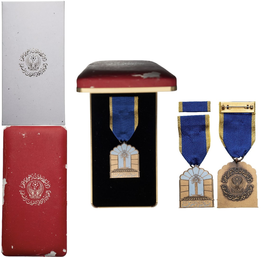 Medal of Superiority, 3rd Class, by Fattorini: Breast Badge, 46x37 mm, gilt Bronze, one-side enameled, original suspension ring and ribbon with ribbon bar. A rare medal, in case of issue with gilt weapon on the lid and cardboard protection box wit