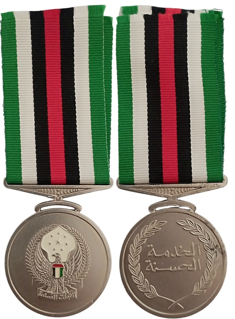 Military Long Service and Good Conduct Medal 1st Type, 2nd Class, by Toye, Kenning & Spencer Ltd.: Breast Badge, 47x40 mm, silvered, one-side enameled, original suspension ring and ribbon. A rare medal, by "Toye, Kenning & Spencer Ltd. - Bedworth, U.K."! R! I