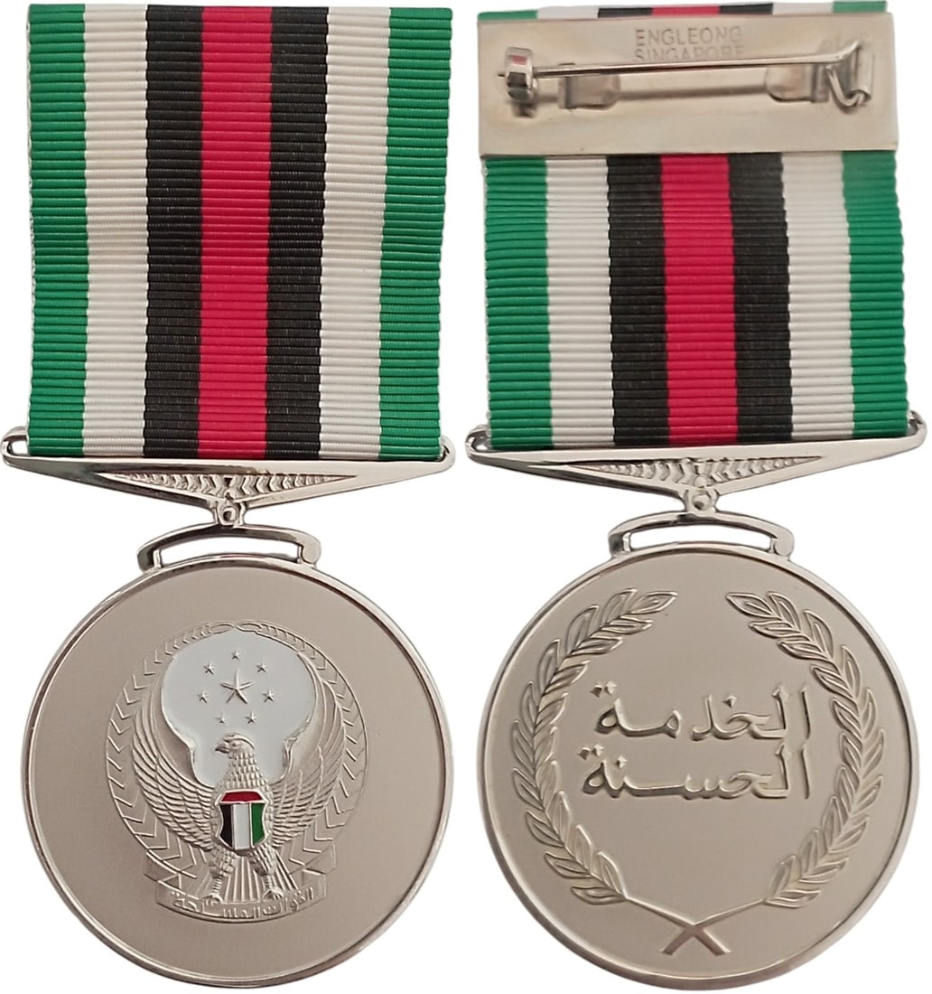 Military Long Service and Good Conduct Medal 2nd Type, 2nd Class, by Eng Leong, Singapore: Breast Badge, 47x40 mm, silvered, one-side enameled, original suspension ring and ribbon. A rare medal, by "Eng Leong, Singapore"! R! I