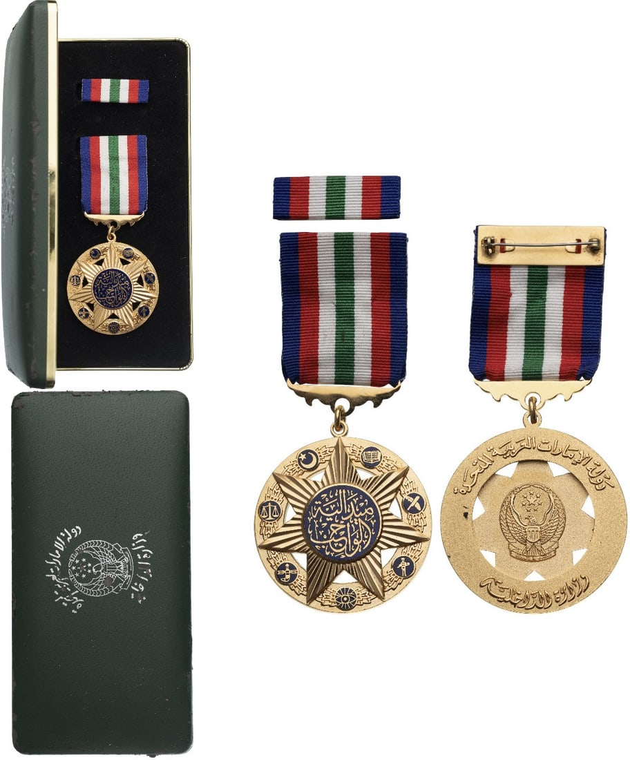Medal of Duty, by Fattorini: Breast Badge, 58x47 mm, gilt Bronze, one-side enameled, original suspension ring and ribbon with ribbon bar. A rare medal, in case of issue with gilt weapon on the lid and cardboard protection box wit
