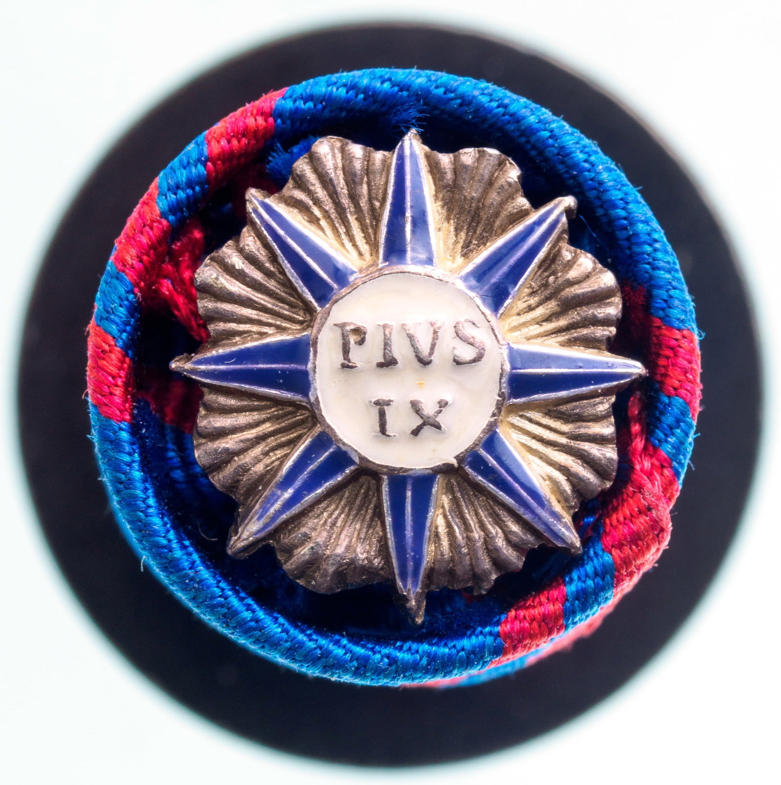 ORDER OF PIUS IX: Lapel Hole Rosette, instituted in 1847. Breast Badge, 11 mm., Silver, enameled. A scarce rosette, in excellent condition. I R!