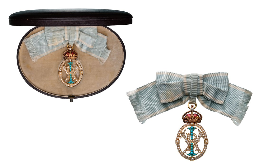 The Imperial Order of the Crown of India: A Badge of the Order in Gold, as an oval, openwork medallion bearing the Monogram “VRI” set with Diamonds, pearls and turquoises, within an oval also set with pearls; smooth reverse; on top a