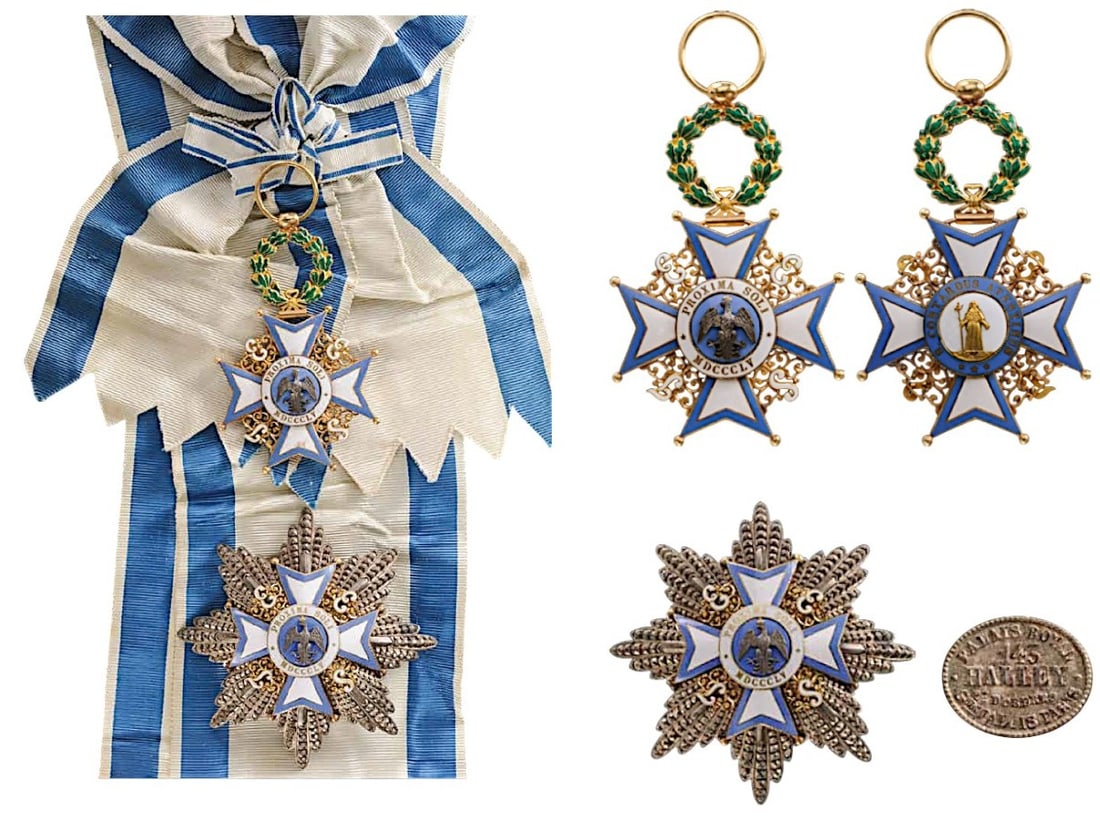 The Order of the Eagle of Este: A Grand Cross set of the Order: Sash Badge in Gold with white enameled arms, bordered with sky- blue enamel and with ball-finials, flanked by white enameled letters composing the name “ESTE”,
