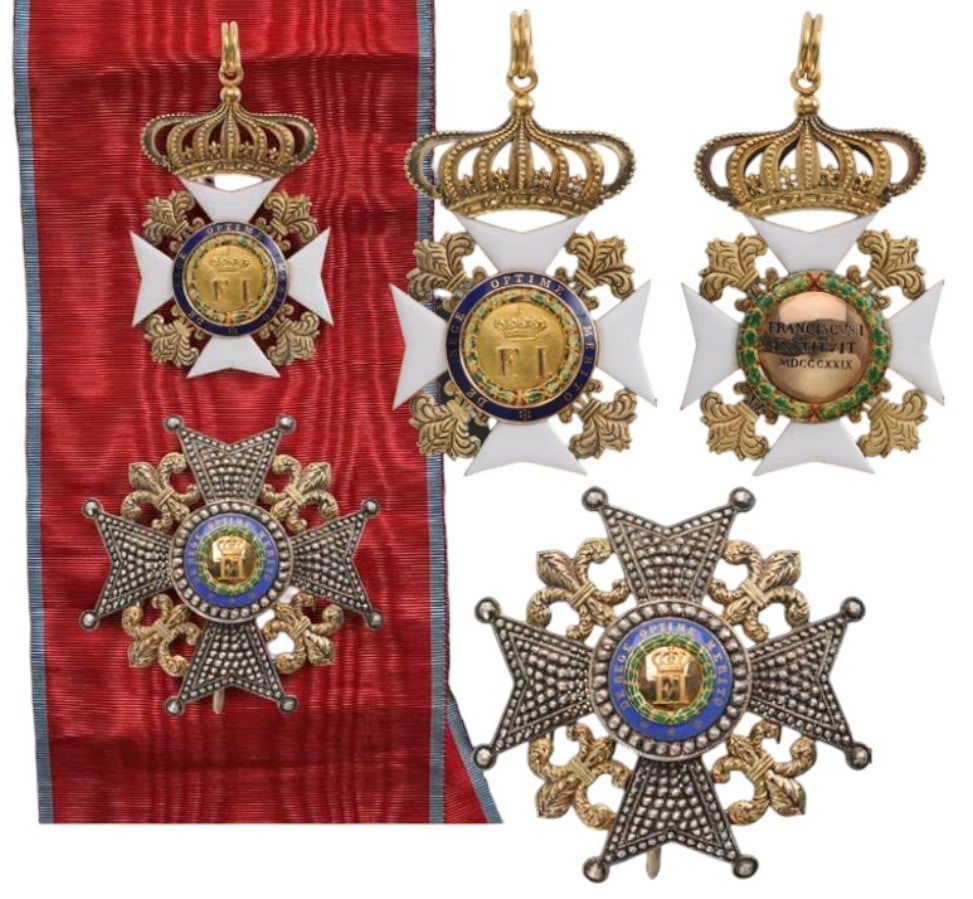 Order of Francis I: A Grand Cross set: Sash Badge in Gold, with white enameled arms, flanked by beautifully chiseled and engraved fleurs de lys with polished and matted details; obverse centre medallion with highly polis