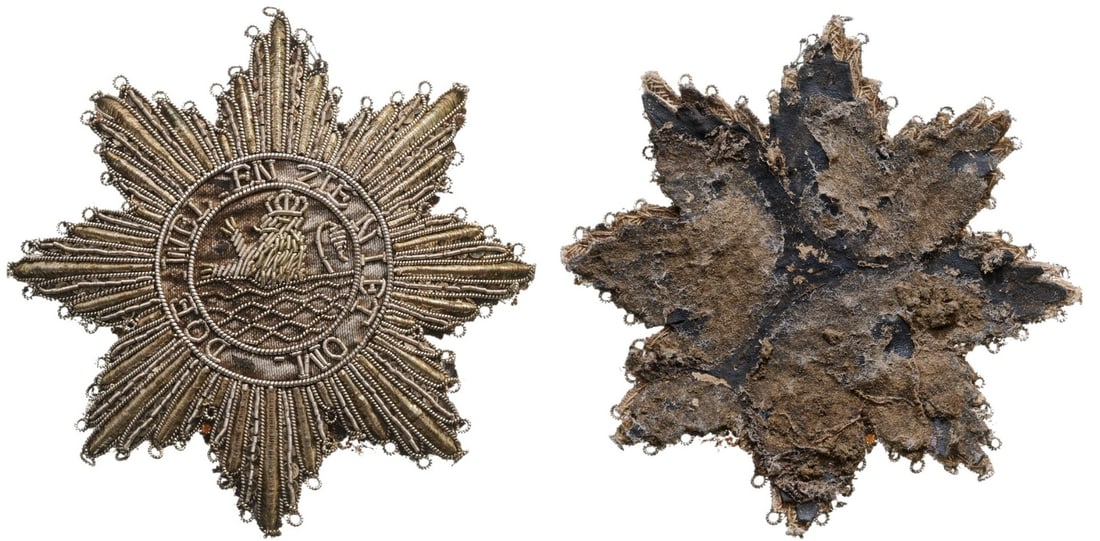 Royal Order of Netherlands: An embroidered Breast Star of the Order: the rays made of Silver thread with tiny loops to af x the star to the habit; round centre depicting a crowned rampant lion rising from waves, within the outer