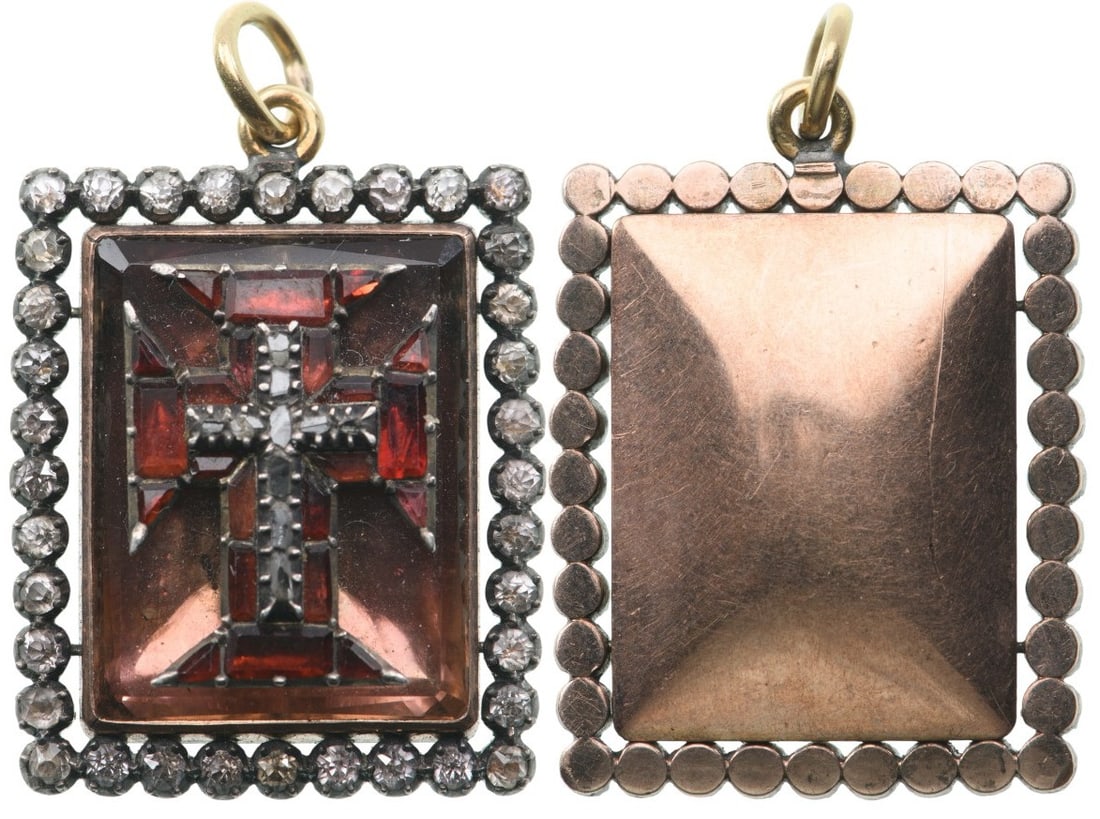 Military Order of Christ: A jewelled badge of the order of an uncommon form: rectangular medallion in Gold, set with a faceted stone superimposed with the cross of the order, completely set with red stones, centered by a cross