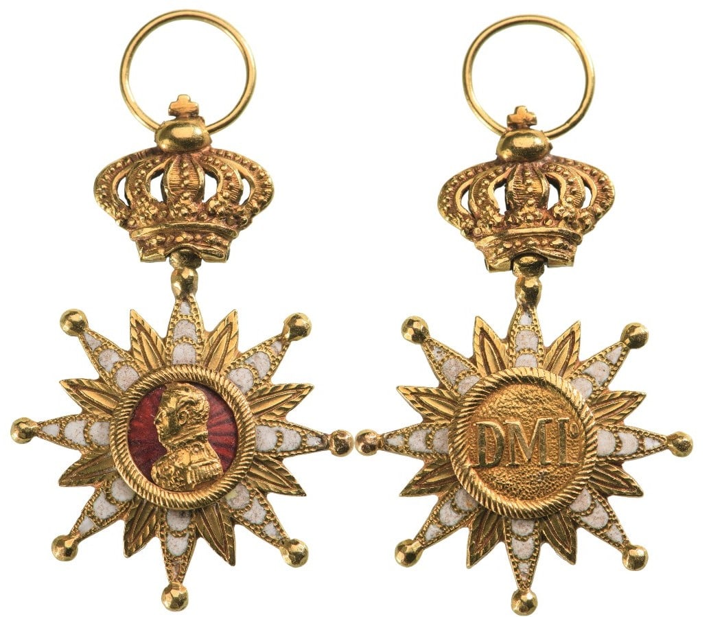 Decoration of Fidelity to Dom Miguel de Bragança: A jewelled decoration in Gold: eight-pointed star; each point set with three diamonds and ending with ball finial, flanked by chiseled beams; red enameled obverse centre medallion with the embossed go