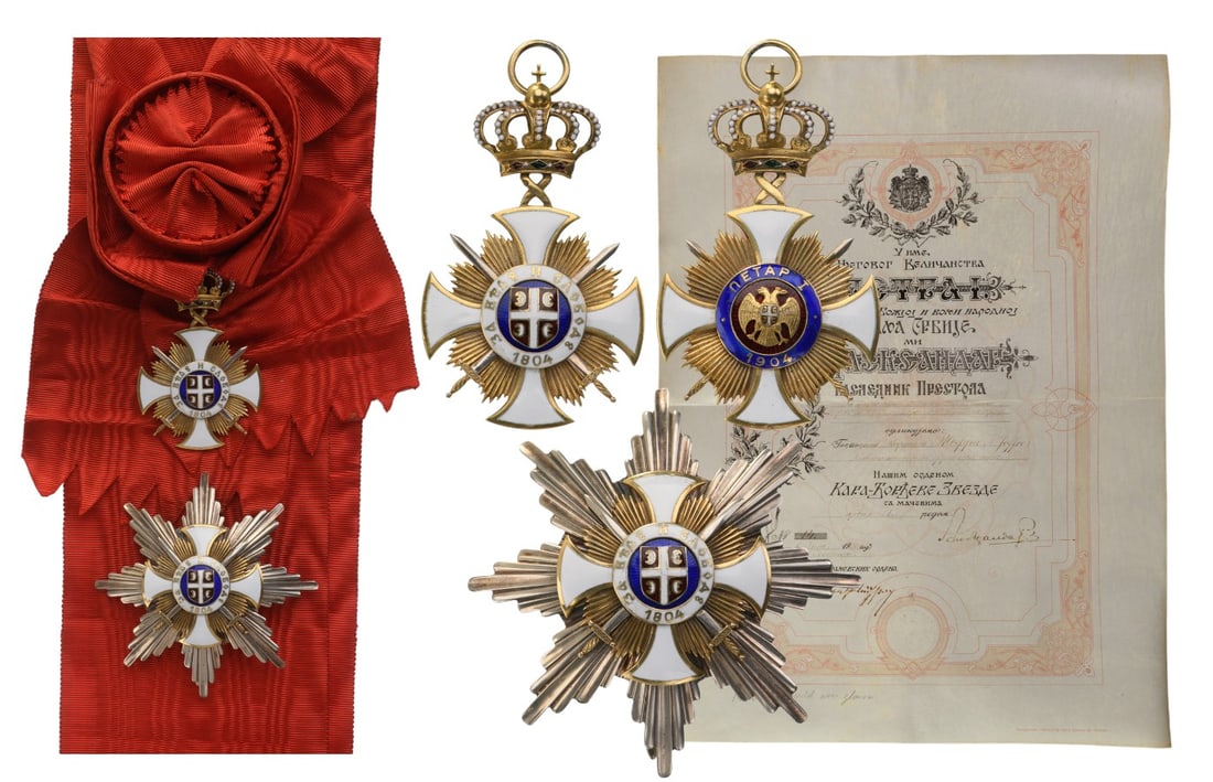 The Order of the Star of Karageorge: The fabulous set of 1st Class (Grand Cross) with Swords together with awarding document to General Louis Joffre: Sash badge in gilt Silver as a white enameled rounded cross flanked by bundles of thin,