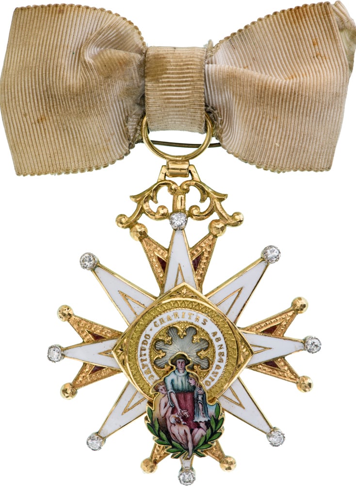 The Order of Charity: A Dame’s Badge of the Order, 2nd type, White Distinction, as golden, purple-red enameled Maltese cross superimposed by a white enameled, 8-pointed star with chiseled borders and ball-finials set wit