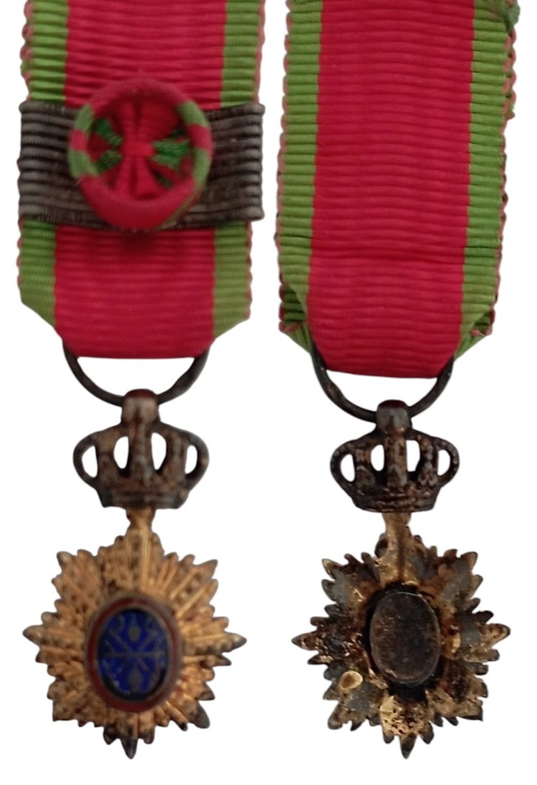 ORDER OF THE DRAGON OF ANNAM: Commander`s Cross Miniature, 3rd Class, instituted in 1886. Breast Badge, 20x12 mm., gilt Silver, brilliant cut rays, central medallion enameled, original suspension crown, ring and ribbon with rosett