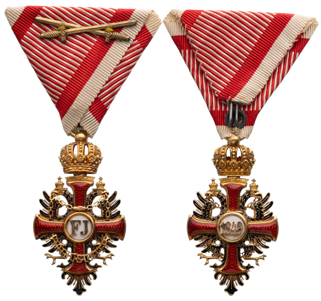 The Imperial Order of Franz Joseph: Knight's Cross, instituted in 1849. Breast Badge, 57x31 mm., GOLD, 13.5 g., maker's mark "V. Mayer's Sohne", original suspension ring and ribbon with swords. Extremely fine condition! I