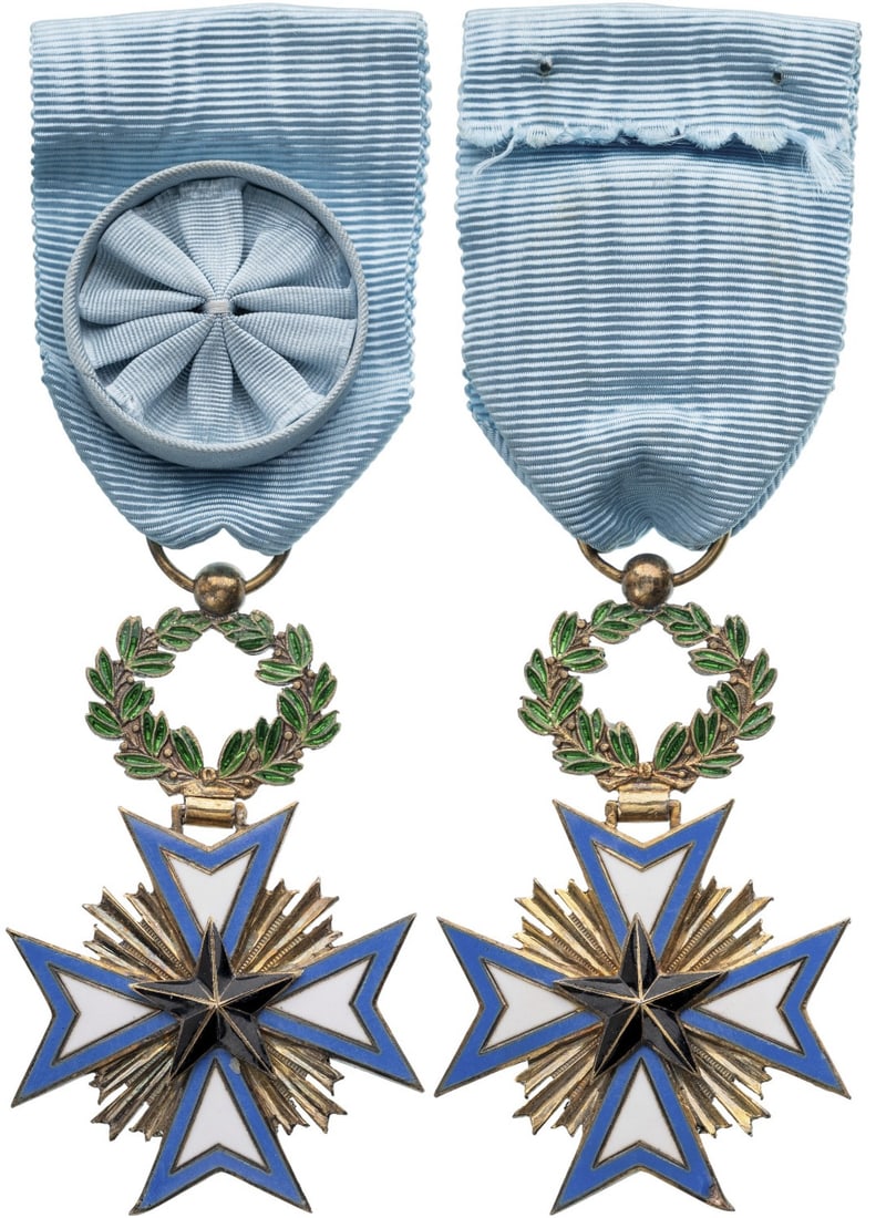 Order of the Black Star: Officer's Cross, instituted in 1889. Breast Badge, 60x37 mm,, gilt Silver, both sides enameled, original suspension ring and ribbon with rosette. Good very fine condition! II