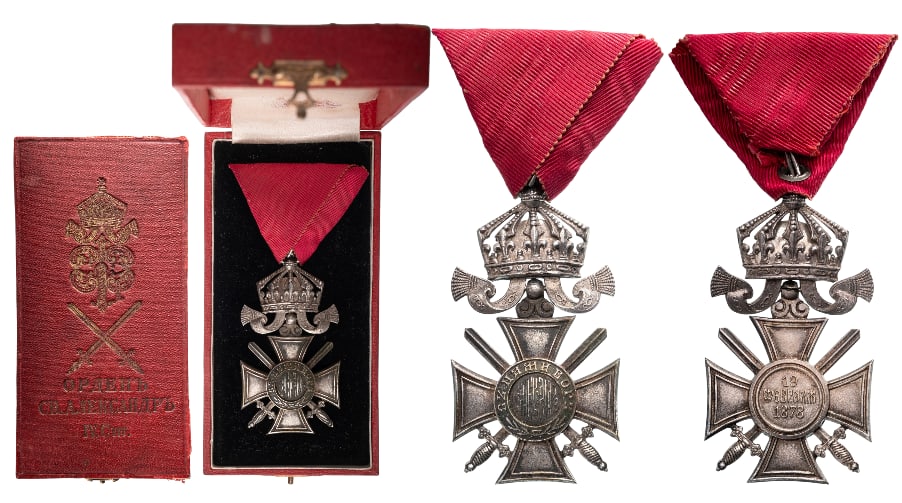 Order of Saint Alexander: 6th Class with crown and Swords, Tsar Ferdinand I issue. Breast Badge, 68x36 mm, silvered, original suspension ring and triangular ribbon, in original case, gilt weapon and inscription on the lid. A b