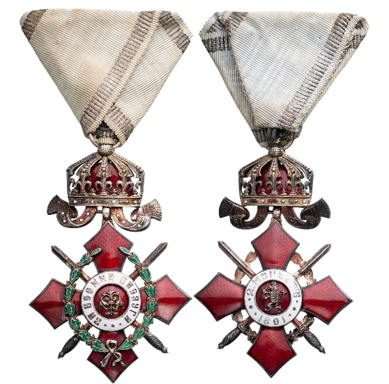 Order of Military Merit: Knight's Cross, 5th Class with Crown and Battlefield Distinction. Breast Badge, 73x48 mm, Silver, central medallion enameled, original suspension crown, ring, and ribbon. Extremely fine condition and 