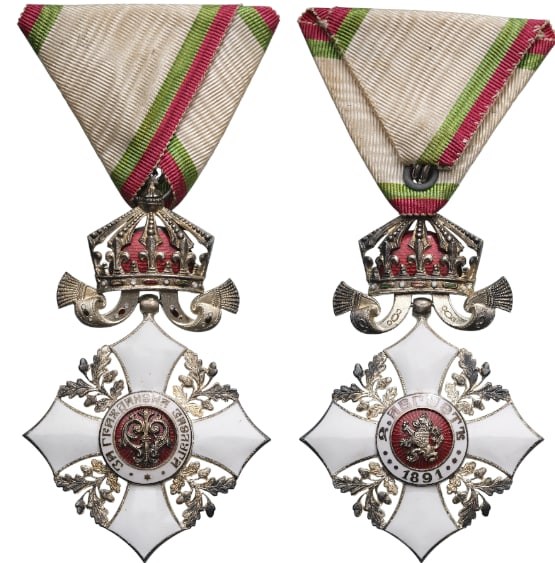 Order for Civil Merit: Knight's Cross with Crown, 5th Class, 2nd Pattern, 1910. Breast Badge, 75x48 mm, silvered, central medallion enameled, original suspension ring and triangular ribbon. A badge of best quality, and extr