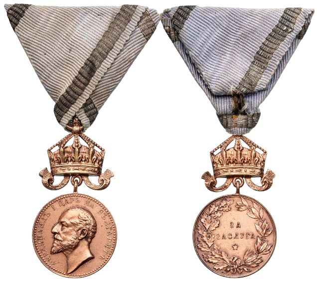 Medal for Merit: 3rd Class with Crown, 5th Type, 1st Model, King Ferdinand. Breast Badge, 51x27 mm, Bronze, original suspension ring and ribbon. A scarce badge, in extremely fine condition! I R!