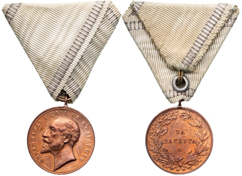 Medal for Merit: 3rd Class, 5th Type, 1st Model, King Ferdinand. Breast Badge, 32x27 mm, Bronze, original suspension ring and ribbon. A scarce badge, in extremely fine condition! I R!