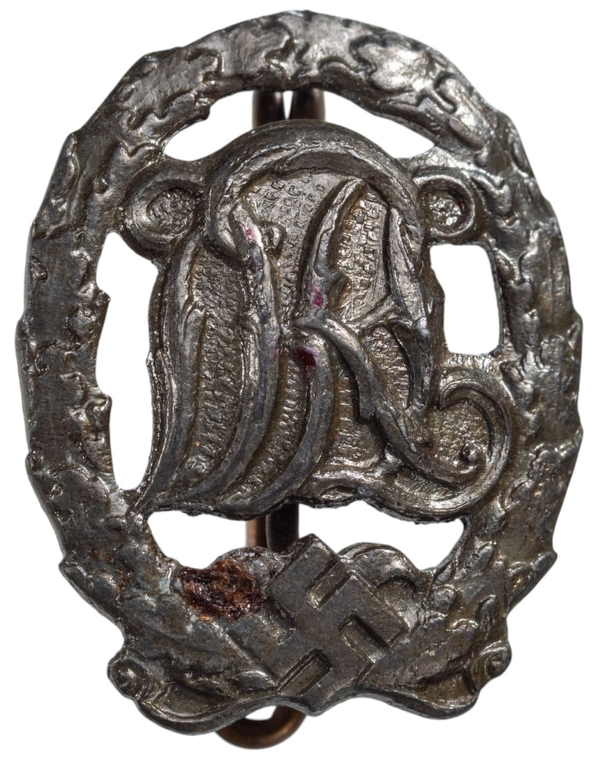 DRL Sports Badge: Silver Grade Award Miniature. Breast Badge, 18x13 mm, silvered Bronze, "E.L.M. maker's mark", original pin on the back. Scarce! I R!