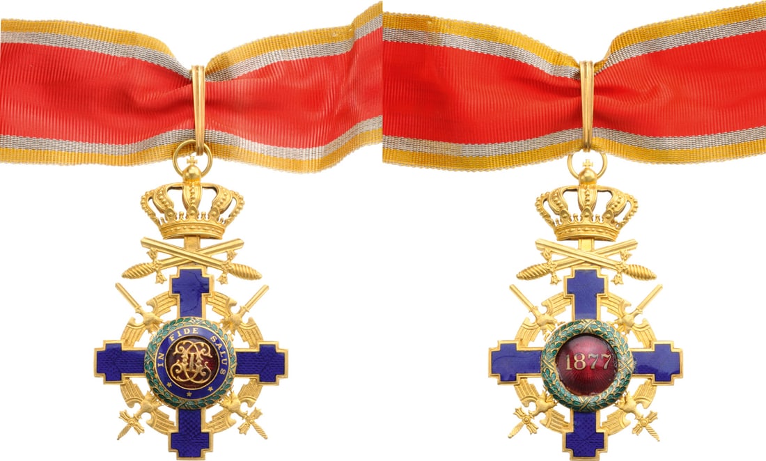 ORDER OF THE STAR OF ROMANIA, 1864: Commander`s Cross, 2nd Model (1940), for Foreign Officer`s in Time of War, 82x52 mm in gilt Bronze, enameled, with original suspension ring, loop and ribbon. Obverse medallion with cipher of Carol I, 