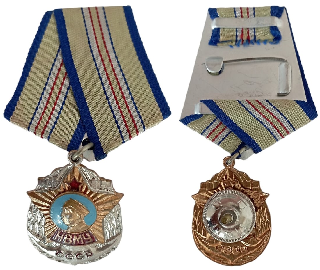Nakhimov Naval Academy Badge: Breast Badge, 27x34 mm, silvered and gilt Bronze, partially enameled, original suspension ring and ribbon with thin pin and screwback on the back. Mint state! I