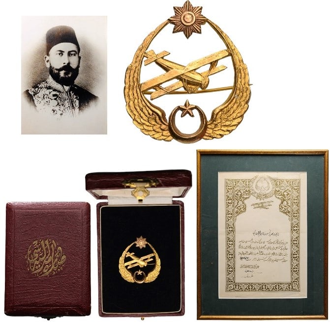 Honour Badge of the Turkish Aeronautics Association (Türk Tayyare Cemiyeti): 1st Class Badge, 39 x 34 mm, GOLD, 2nd model of the Khilafat period, a flying double-decker airplane, within an oval made by two open wings linked by the Turkish crescent at the base and on top, the s