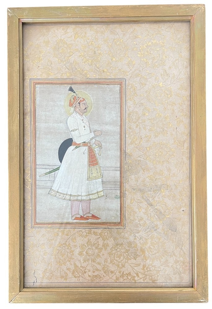 Watercolor on Paper depicting a Notable from Ancient India: Watercolor on fine paper depicting a notable from ancient India in a traditional kurta, wearing juttis, standing in profile, belt and feathered headdress adorned with precious stones. The man is weari
