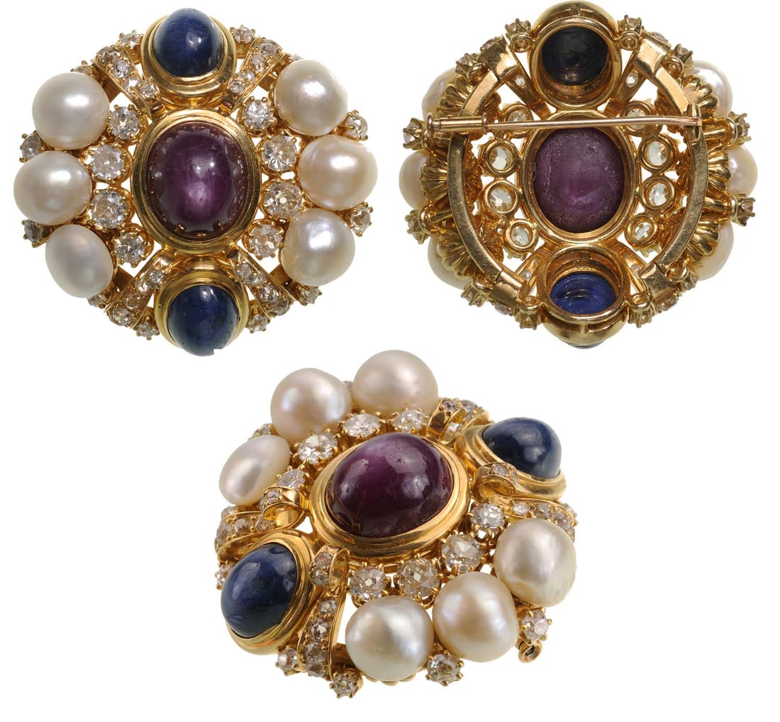 European Baroc Broach, Gold, Star-Ruby, Diamonds, Sapfirs and South-See Pearls: Broach in Gold, 40.36 g, 750 title, 43x40 mm, 4 ct, Diamonds, Quality "G, Si 1", superb white color, Cabochon 11 ct. red Star-Ruby, 2 Cabochon 10 ct. blue Saphirs, 8 South- See Pearls, 9 mm. An extrao