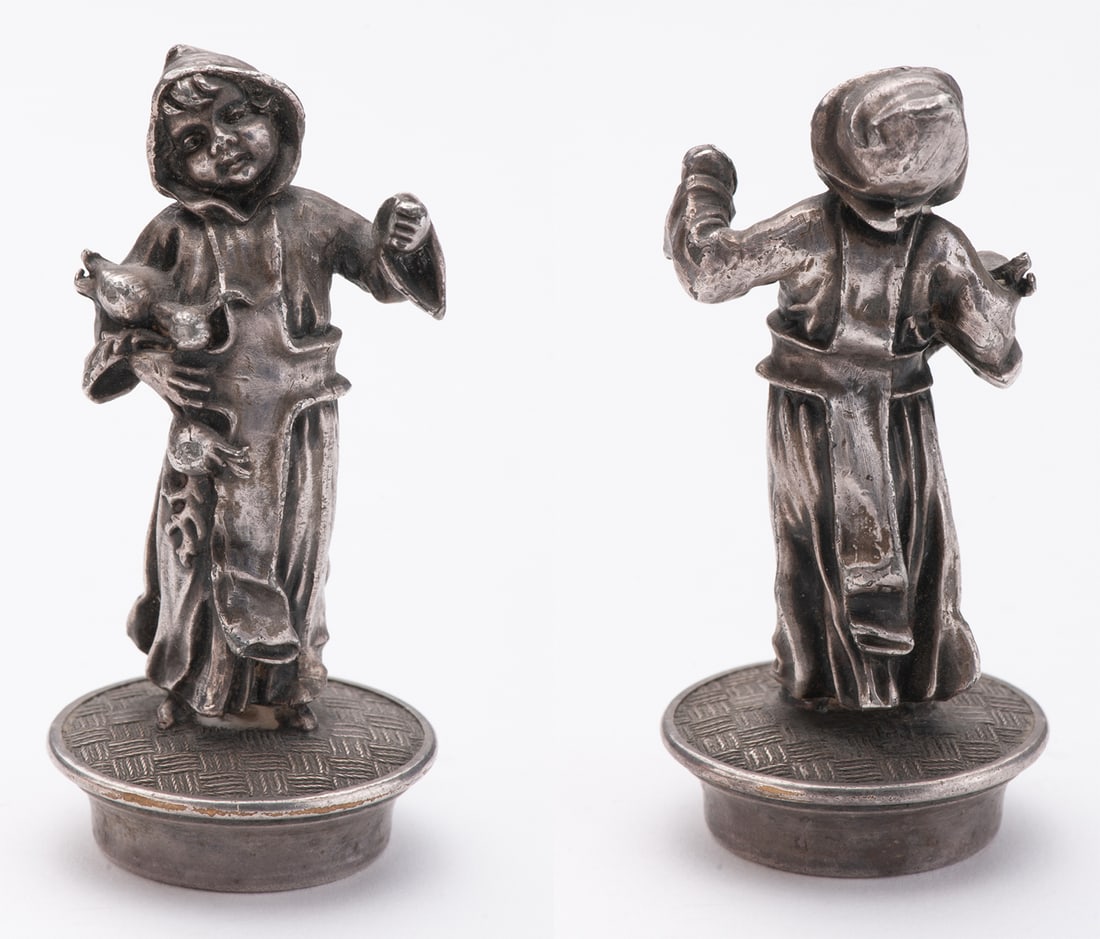 Silver bottle stopper, cast and carving, subject of a young monk picking grenades: "Late 19th Century, probably Germany, no mark. Height 7 cm, weight 60 g. Good condition.