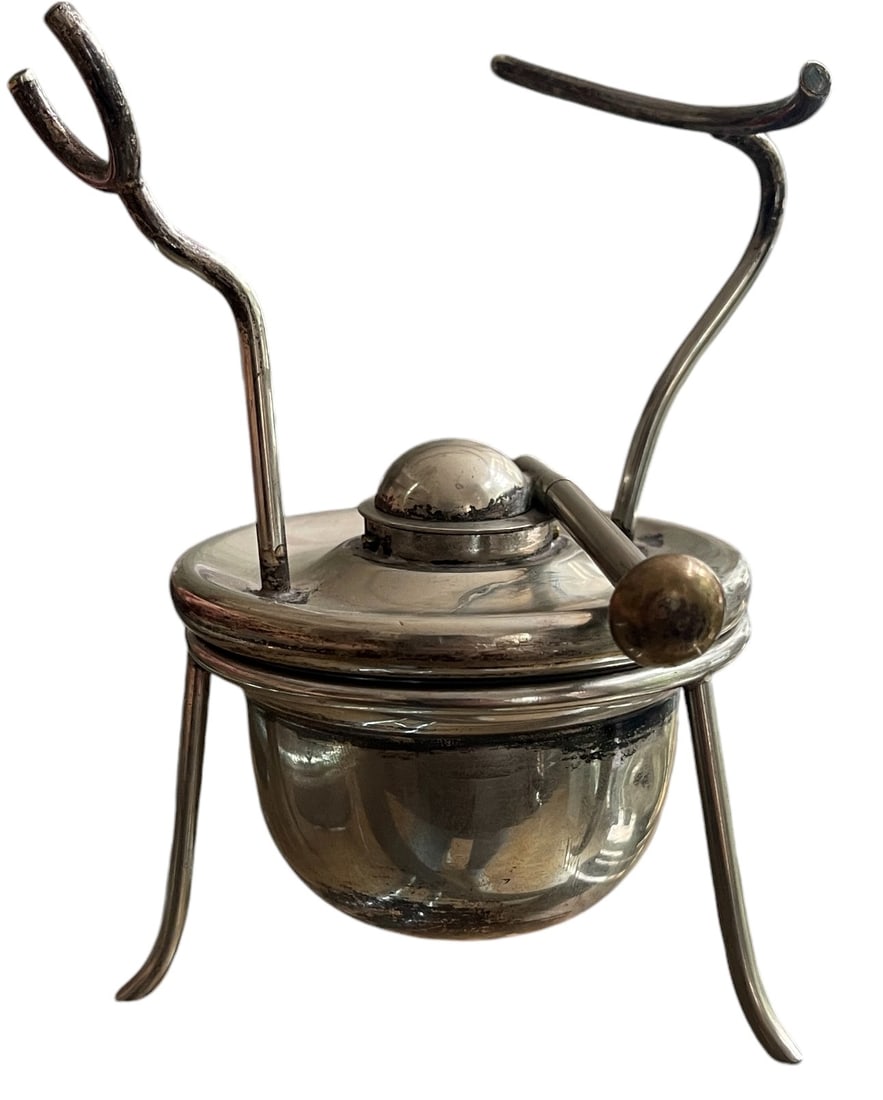 Silvered Tea warming oil or Spirit Burner: Typical English Silvered tea oil or spirit burner with stand used to warm a tea kettle. Dimensions with stand: 12.5x8.5 cm. Very good condition.