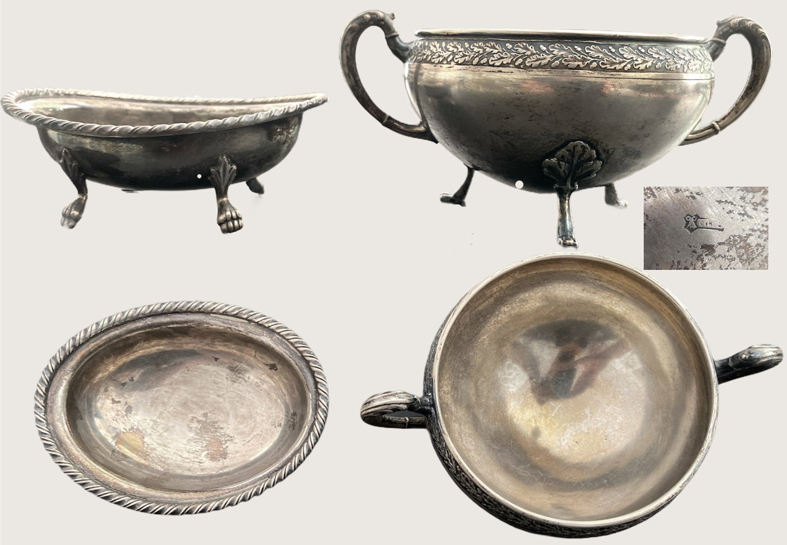 Nice lot composed of two silver table elements: Nice lot composed of two silver table elements: 1. cup with three legs in leafy appliques, openwork side handles, oak leaves in frieze. Weight 163g, height 6 cm, length 10,5 cm. 2. oval spice cup