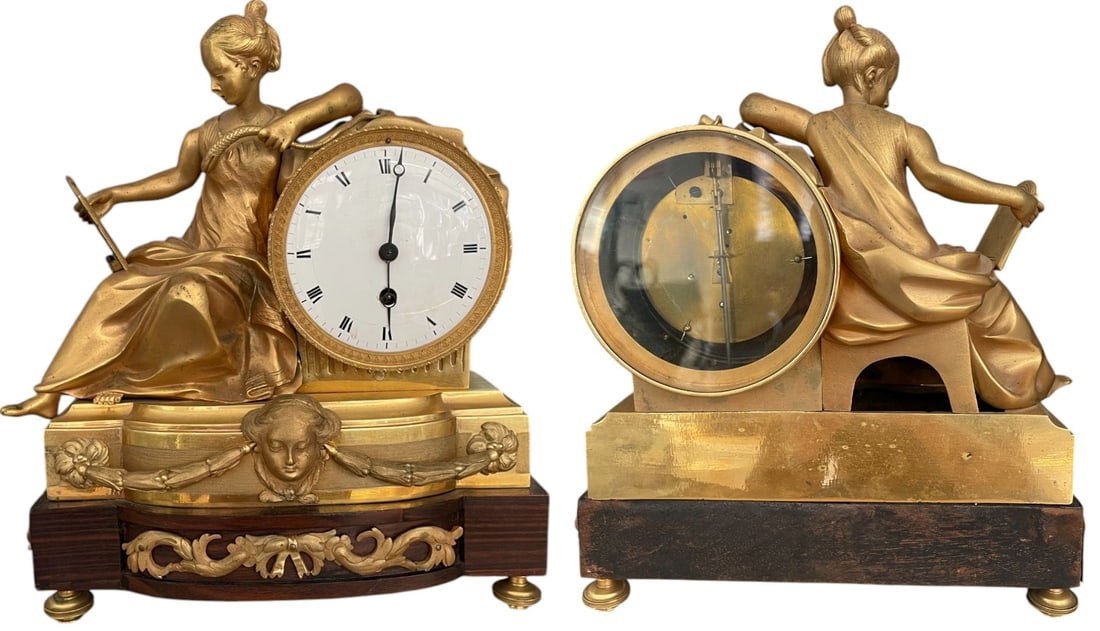 Allegory of Wisdom Mantel Large Mantel Clock: Important bronze mantel clock in Bronze Gilt, representing a woman with a mirror as an Allegory of Wisdom and a mirror as an Allegory of Self-Reflection on a wooden base with bronze feet. Late Louis