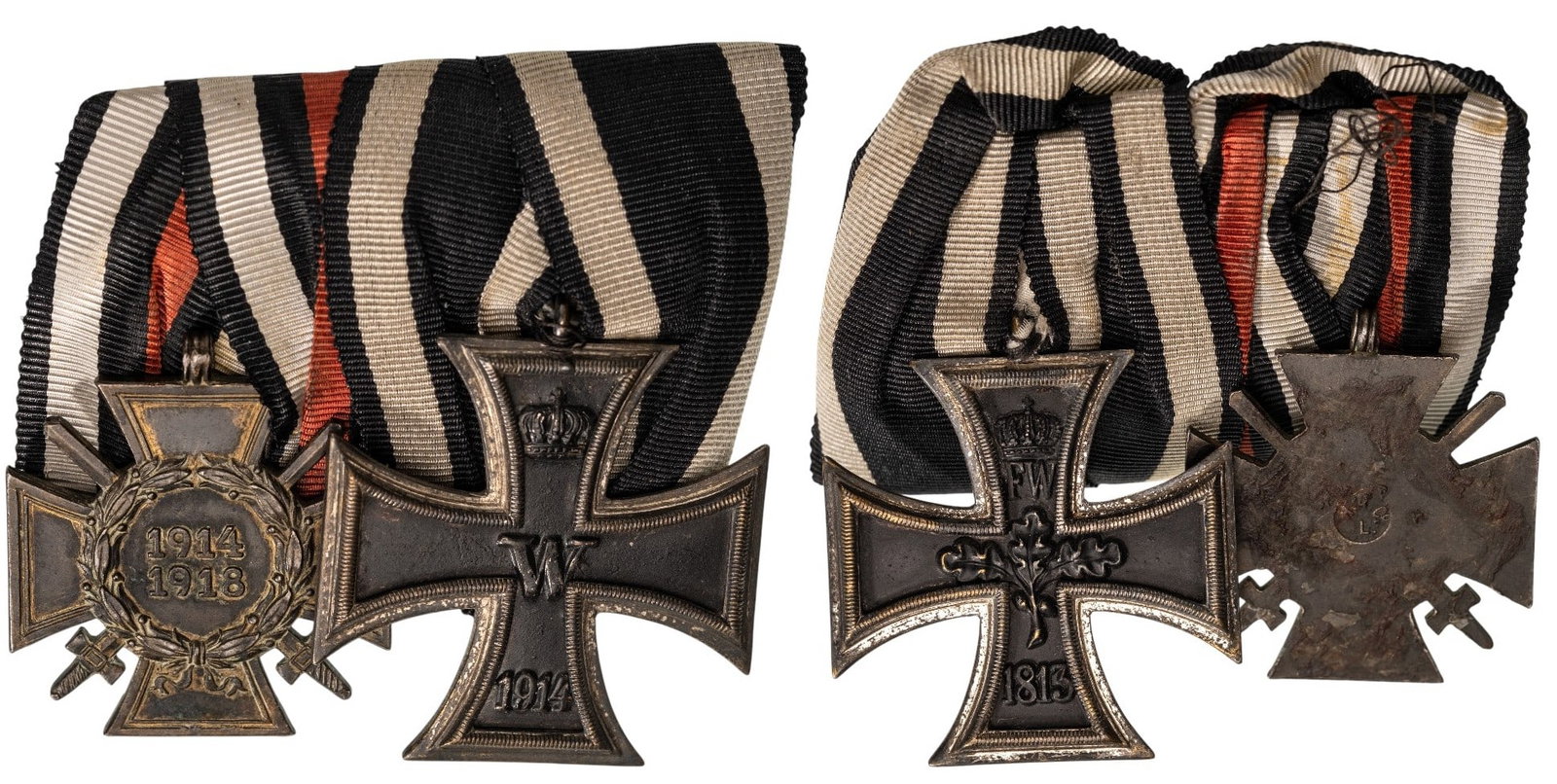 THE COLLECTION OF ORDERS AND MEDALS BARS - Bar of 2.: Iron Cross, 1st WW, 2nd Class, 46x43 mm., Silver; The Honour Cross of the World War 1914-1918, 42x37 mm., Bronze, original suspension rings and ribbons, on bar with long fixation pin. A very nice grou