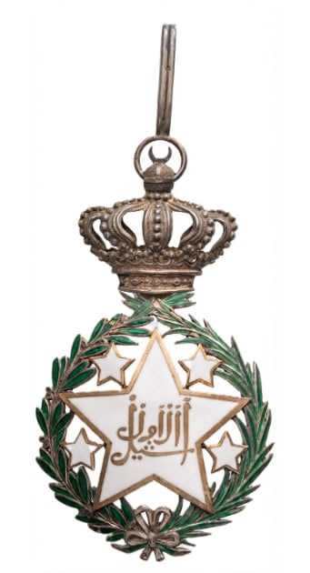 ORDER OF THE SOUTHERN CONSTELLATION: Commander's Cross, instituted by Antoine de Tounens on the 8th of September 1875. Neck Badge, 86x50 mm., partially gilt Silver, enameled, original suspension crown, ring and loop. Superb very rare and