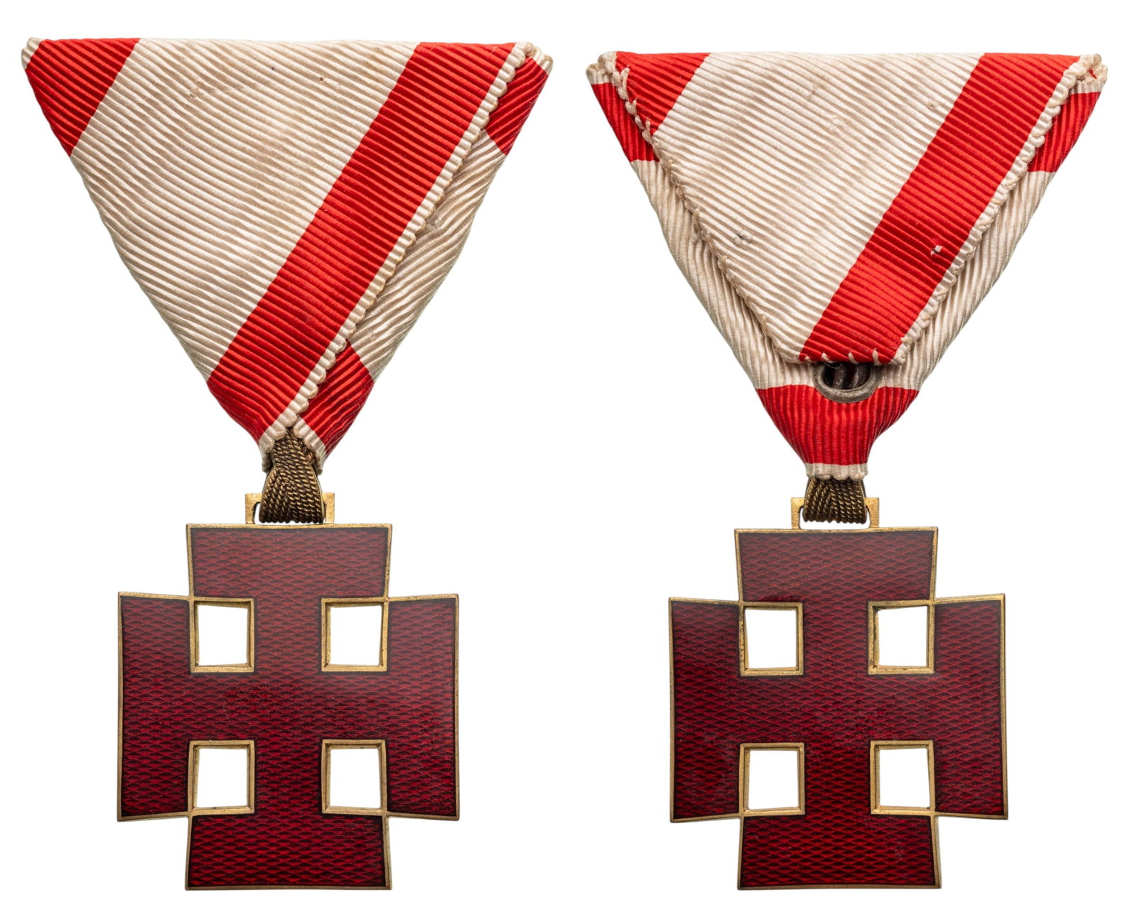 Order of Merit: Knight`s Cross, instituted in 1934. Breast Badge, 37x32 mm, gilt Silver, red enameled, original suspension ring and triangular ribbon. Mint condition. I