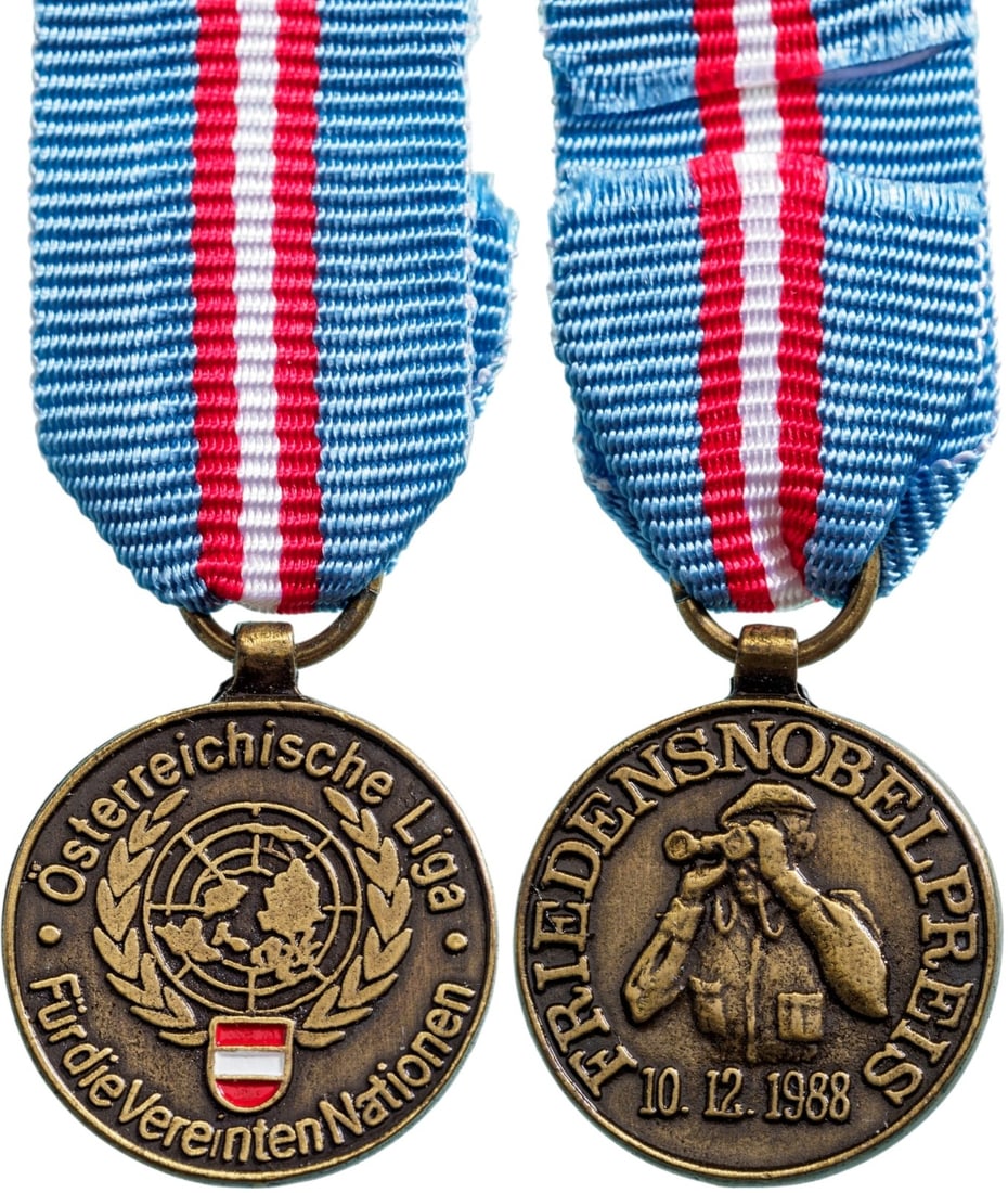 The Peace Nobel Price Medal, 10.12.1988, Austrian Liga: Breast Badge, 19x15 mm., Bronze, original suspension ring and ribbon. A rare miniature, in mint condition! I R!