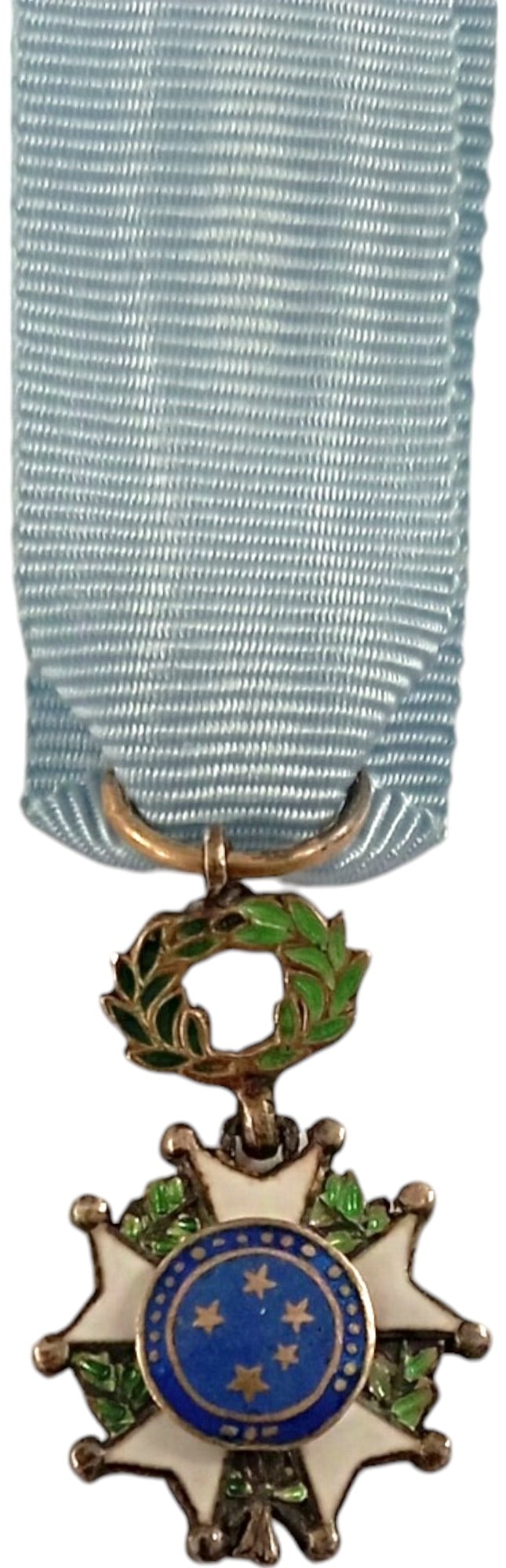 Imperial Order of the Southern Cross: Officerâ??s Cross Miniature. Breast Badge, 23x15 mm, gilt Silver, one-side enameled, original suspension wreath, ring and ribbon.An extremely fine badge, in mint condition!I