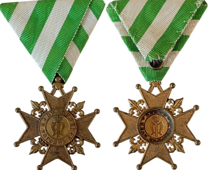 Cross For the Accession of Prince Ferdinand I in 1887, 2nd Class, by C. F. Rothe, Vienna: Breast Badge, 48x42 mm., gilt Bronze, reverse center replaced, original suspension ring and ribbon. IV