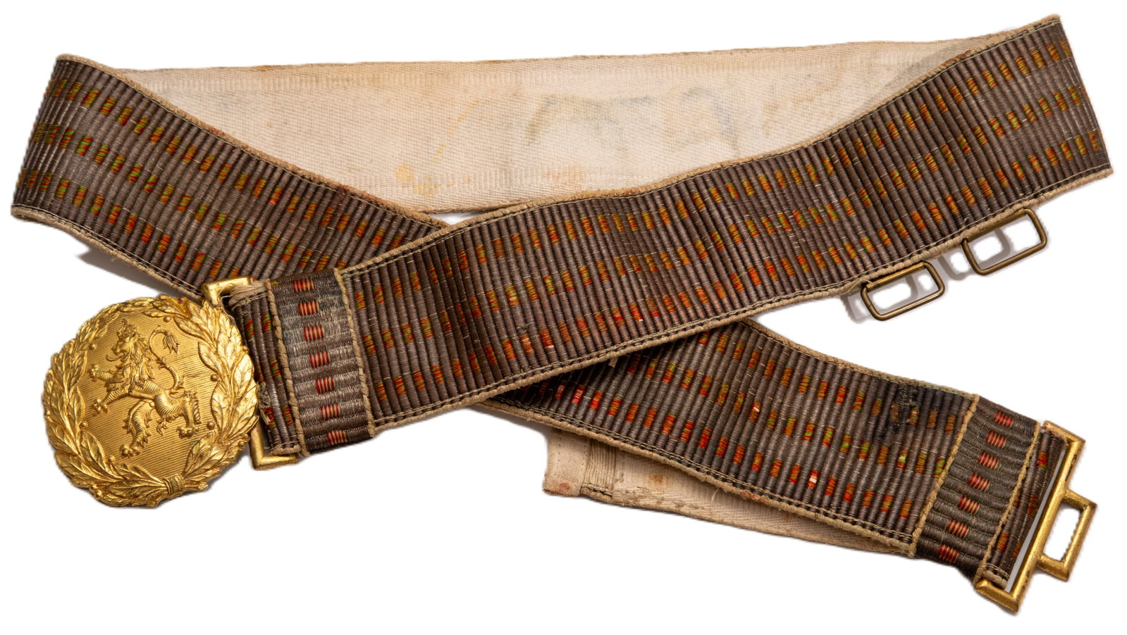 Army Officerâ??s Parade Belt: Silver brocade, intertwined with threads at the Bulgarian colours, mounted on a thick, off-white fabric backing, two en-suite brocade/fabric-backed sliders and two rectangular, brass rings to snap